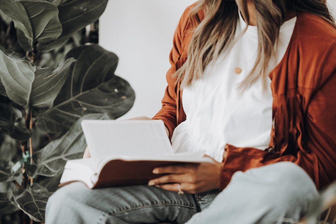 woman reading thriller book