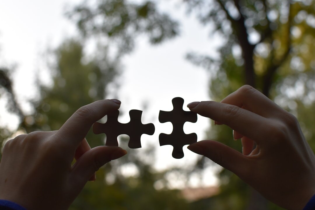 people solving puzzle
